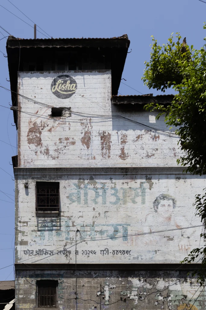 A ghost sign from Pune that advertises Lisha undergarments and Gluco biscuits